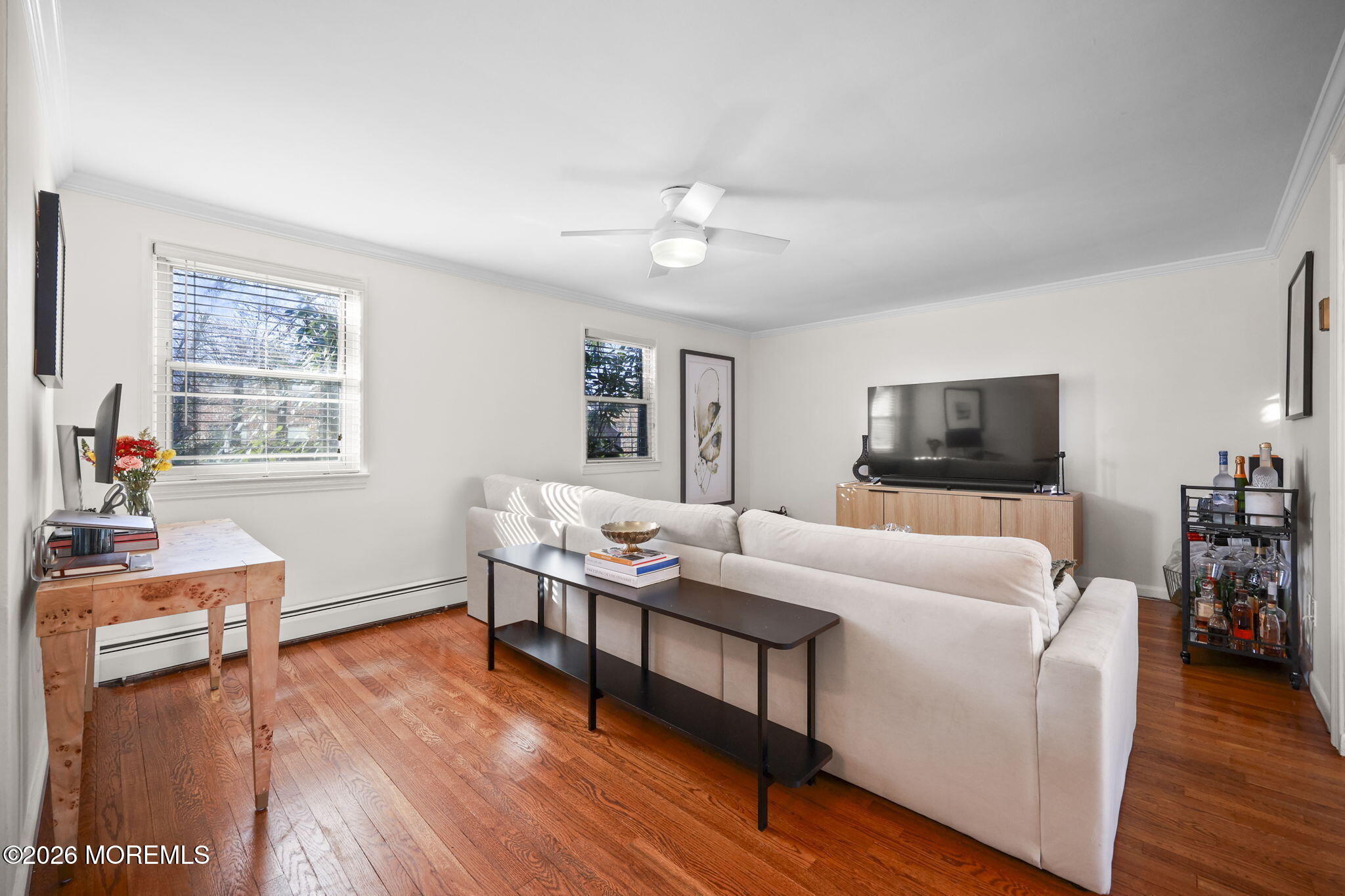 39 Manor Drive Red Bank, NJ 07701 - Photo 2 of 19 a living room with furniture and a flat screen tv