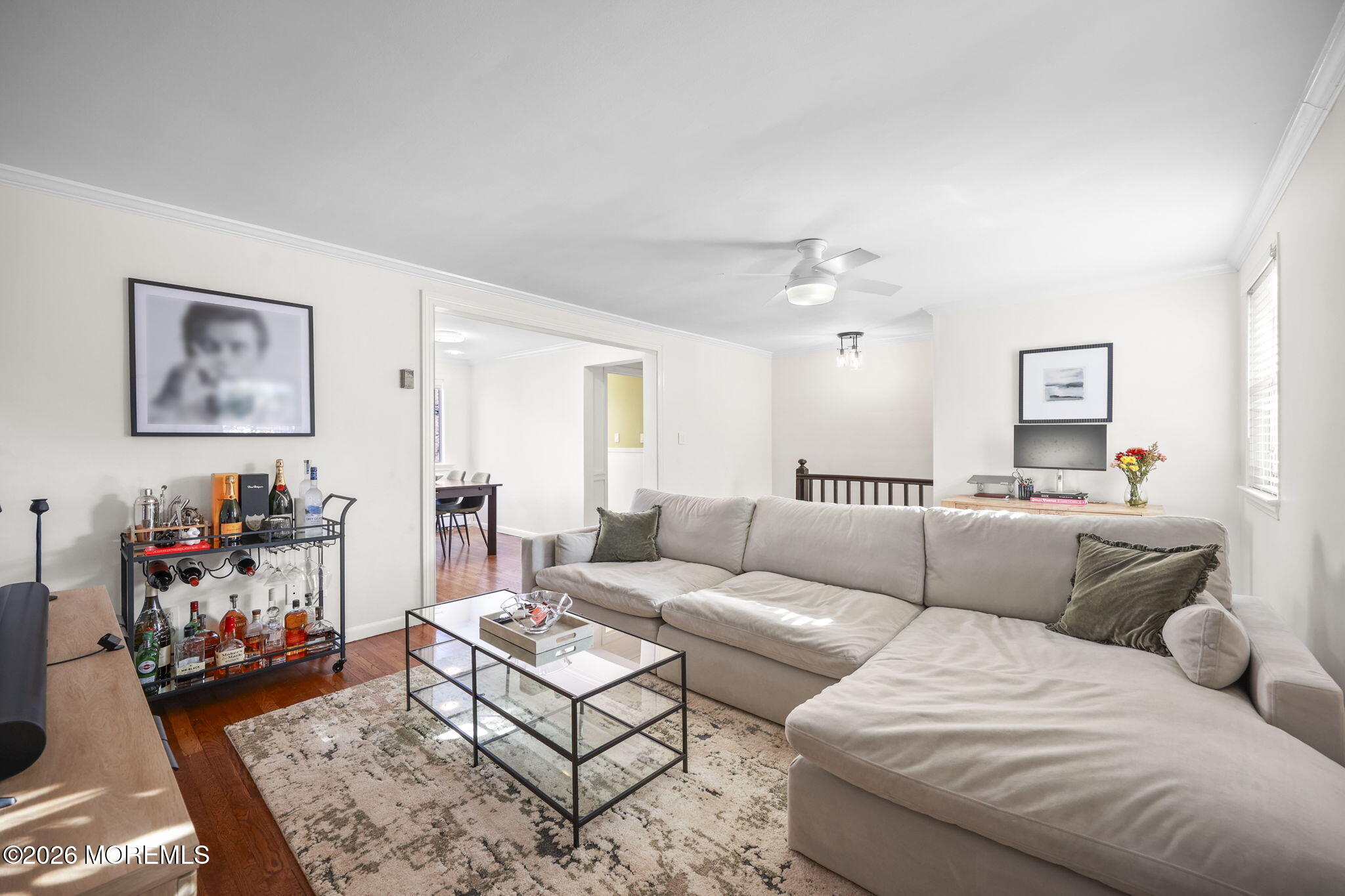 39 Manor Drive Red Bank, NJ 07701 - Photo 6 of 19 a living room with furniture a rug and a dresser