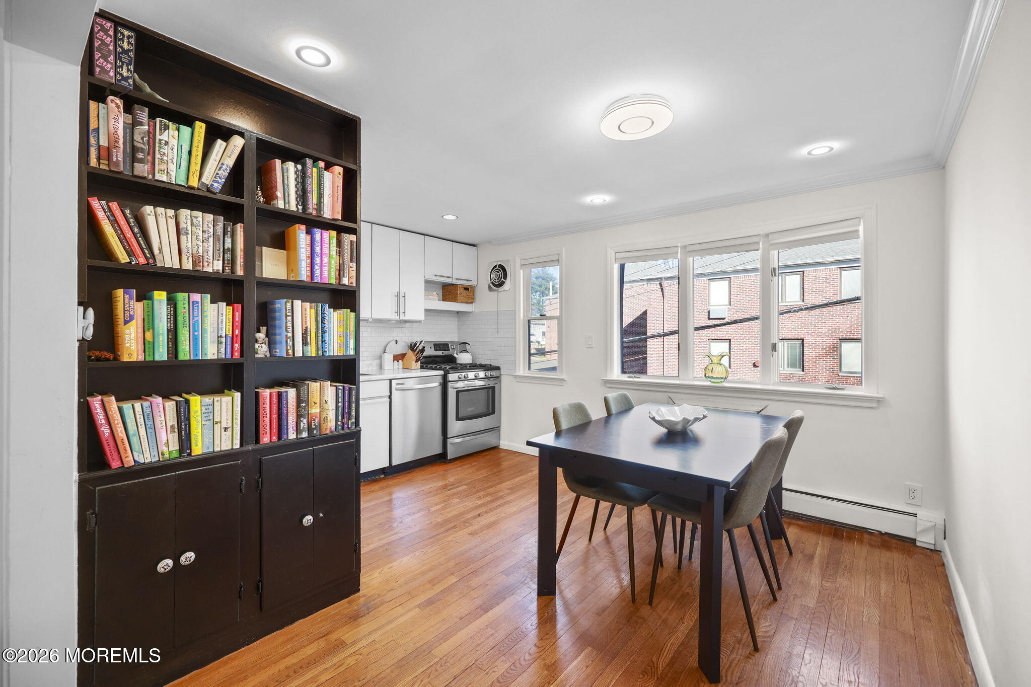 39 Manor Drive Red Bank, NJ 07701 - Photo 7 of 19 a view of a workspace with furniture and a bookshelf
