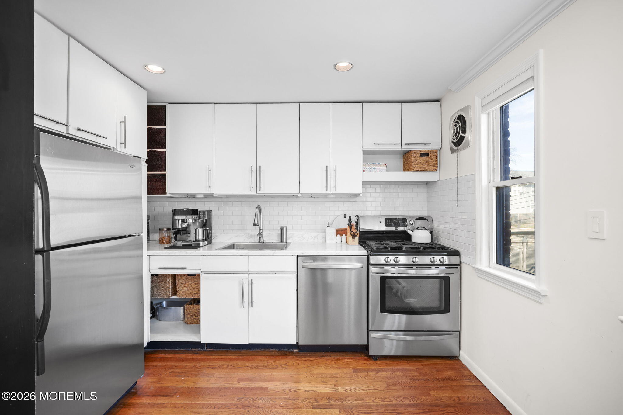39 Manor Drive Red Bank, NJ 07701 - Photo 9 of 19 a kitchen with stainless steel appliances granite countertop a stove a refrigerator and a sink