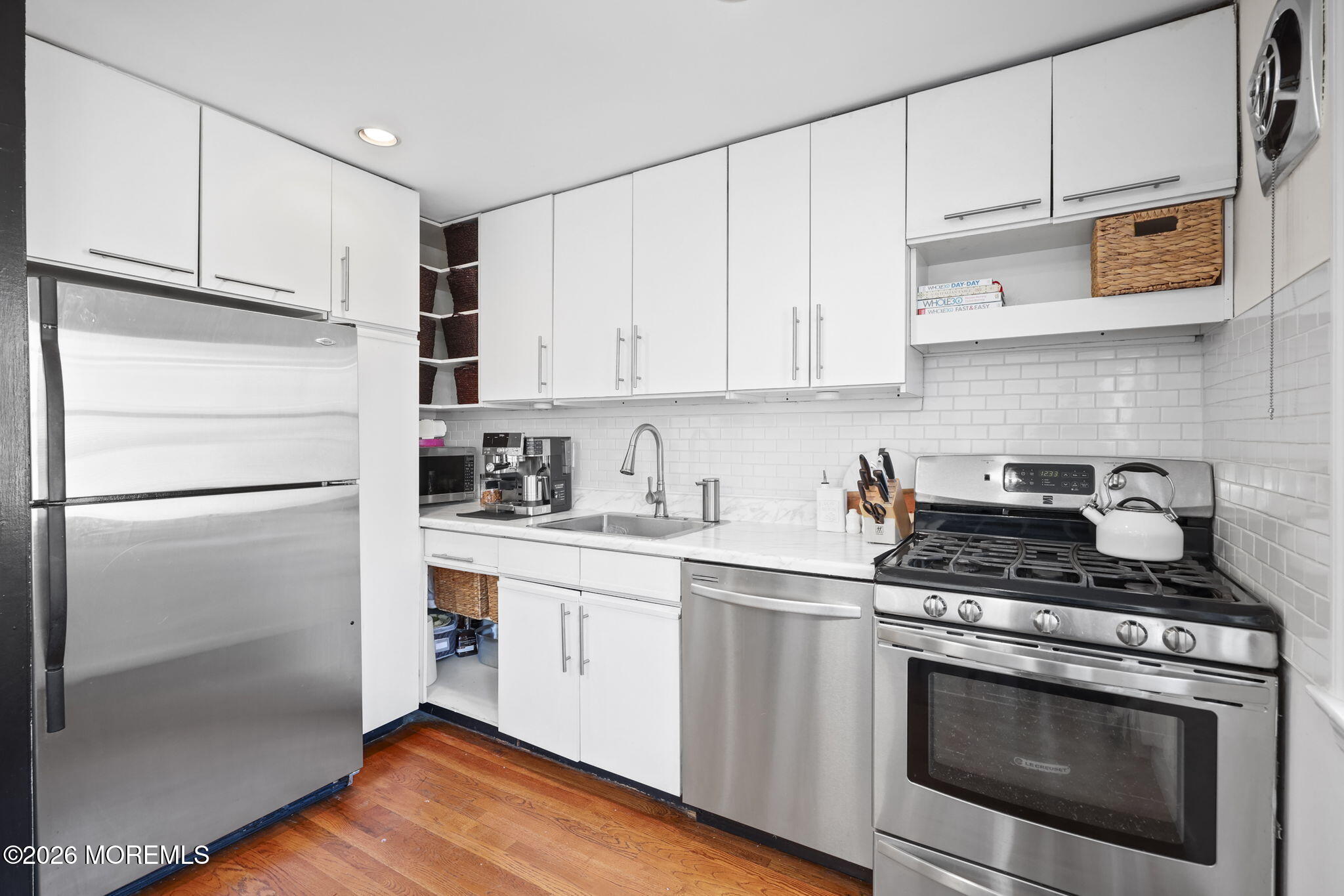 39 Manor Drive Red Bank, NJ 07701 - Photo 10 of 19 a kitchen with stainless steel appliances granite countertop a refrigerator sink and cabinets