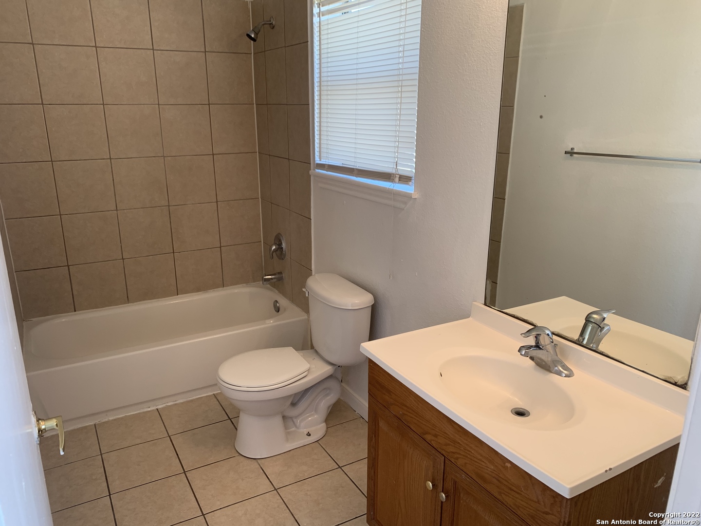 6911 Hallie Ridge San Antonio, TX 78227 - Photo 12 of 22 a bathroom with a sink a toilet and shower