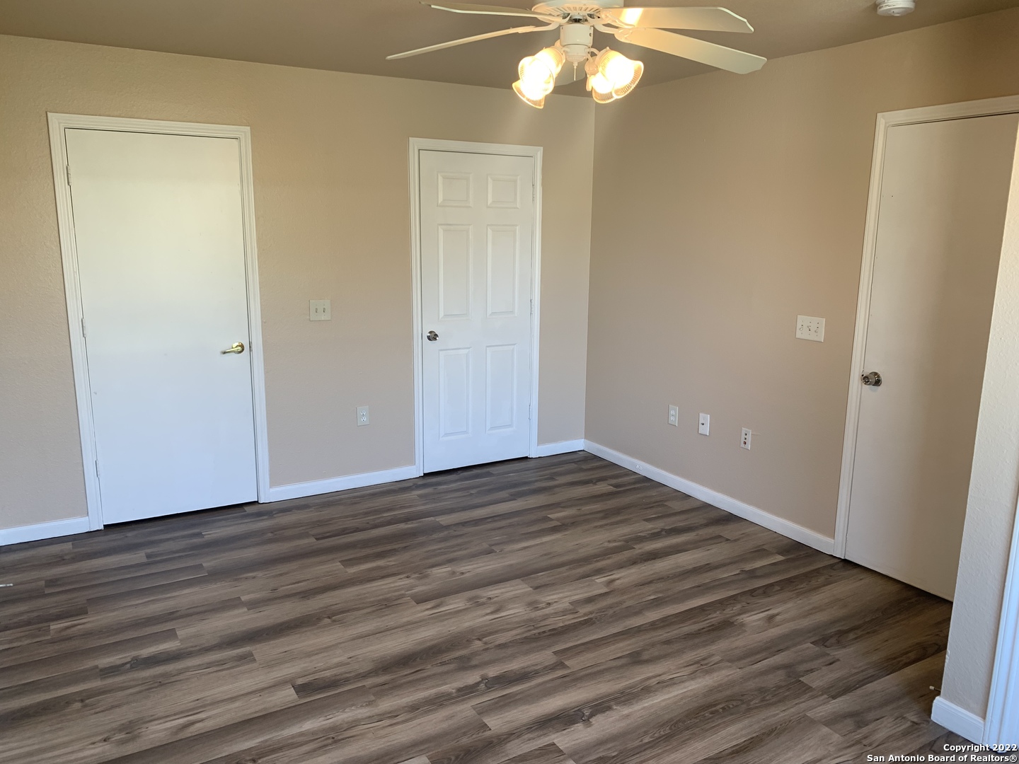 6911 Hallie Ridge San Antonio, TX 78227 - Photo 15 of 22 a view of an empty room with wooden floor