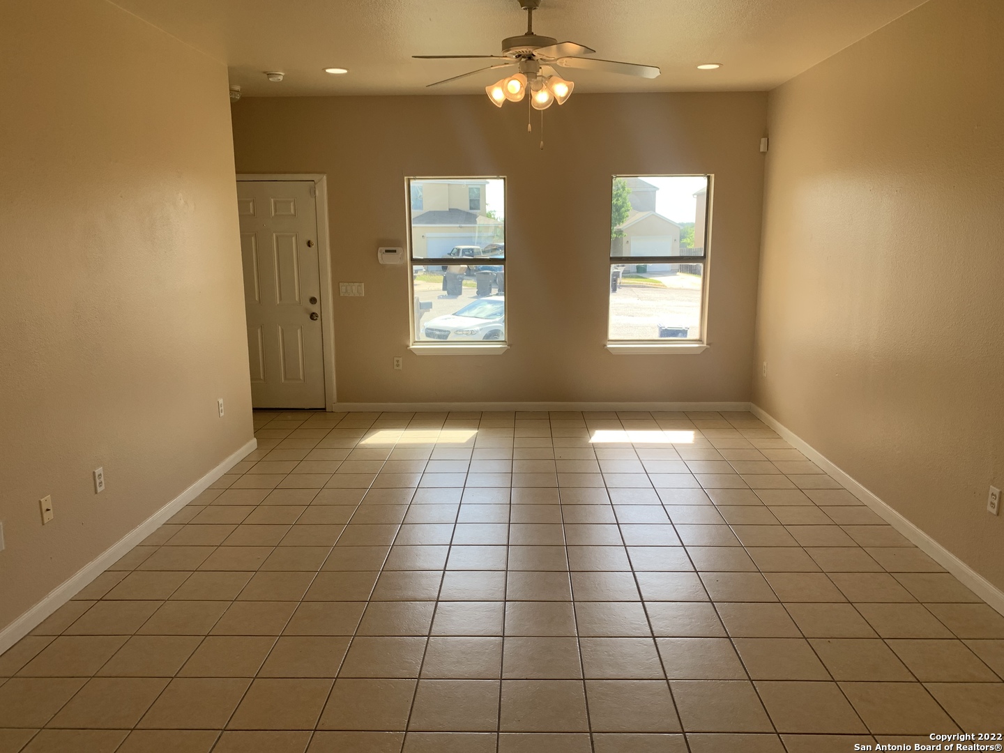 6911 Hallie Ridge San Antonio, TX 78227 - Photo 8 of 22 a view of an empty room with glass door