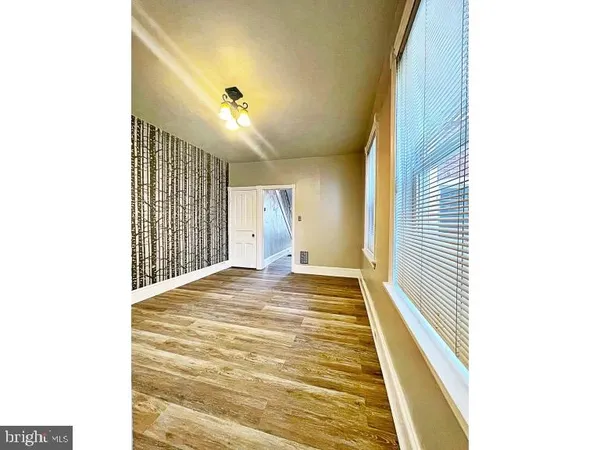 a view of a hallway with windows