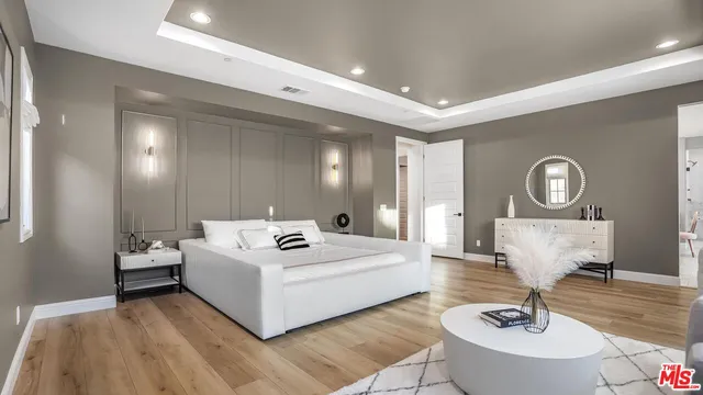 a bathroom with a toilet a sink and a mirror