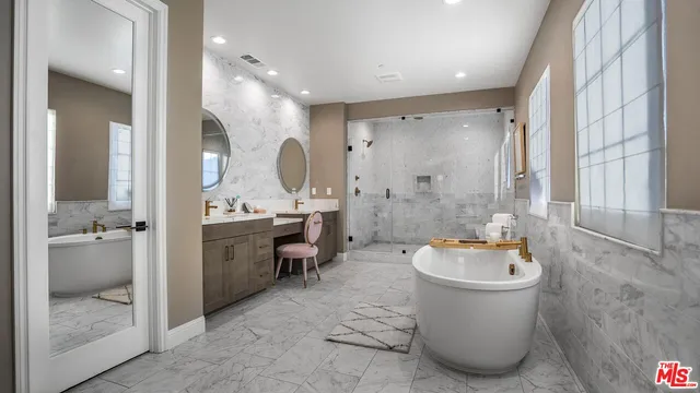 a bathroom with a sink mirror and toilet