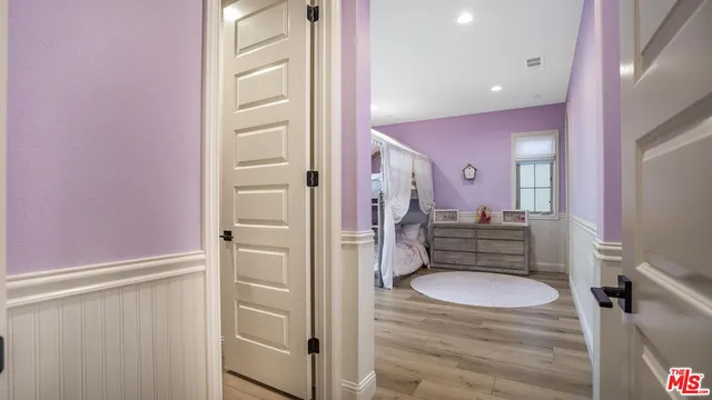 a utility room with cabinets washer and dryer