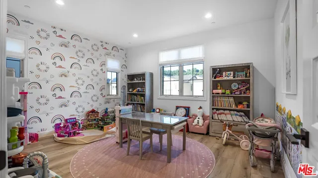 a patio with glass top table and chairs