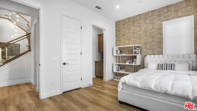 a bathroom with a toilet sink and a mirror