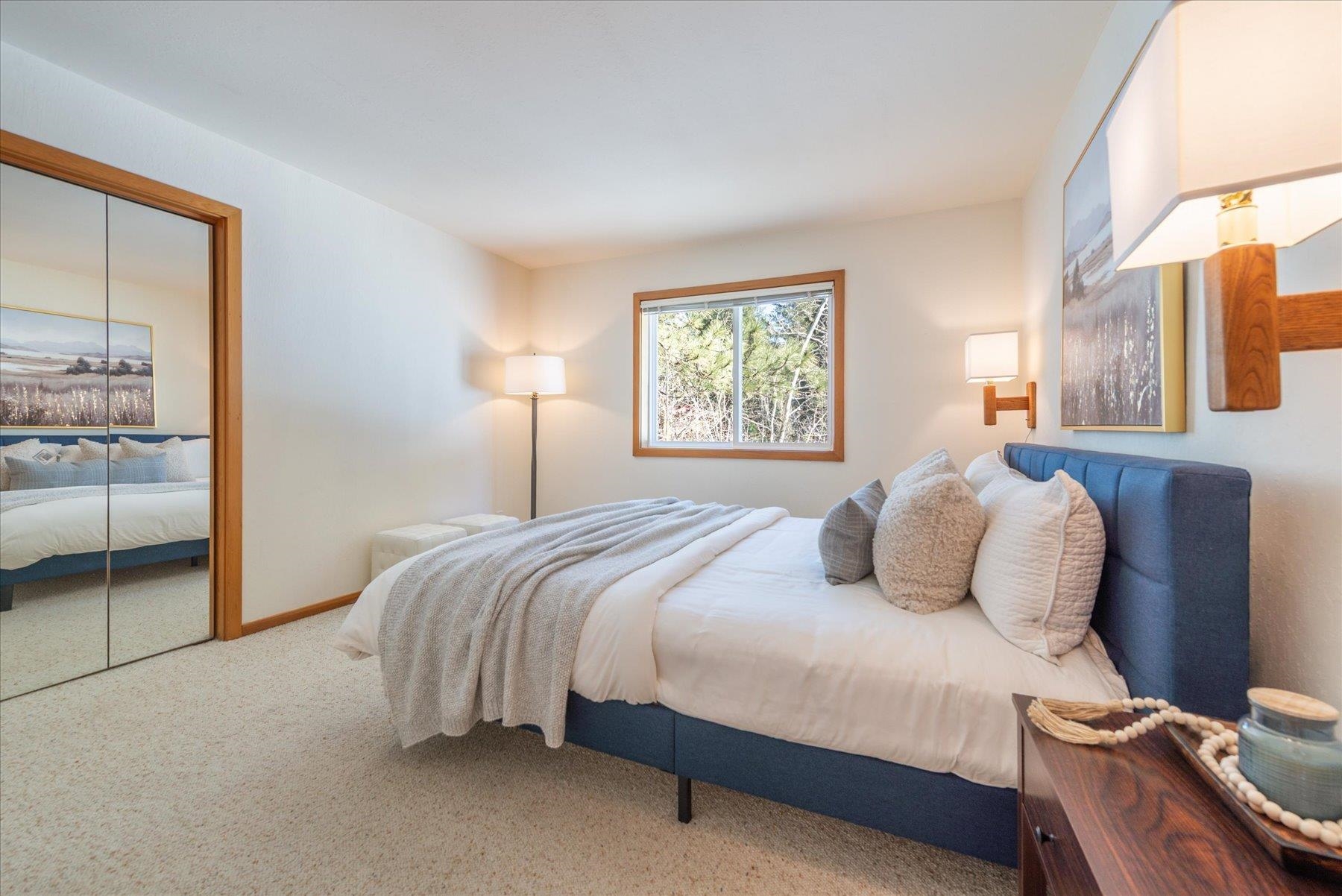 265 Basque Drive Truckee, CA 96161 - Photo 11 of 25 a bedroom with a bed and large mirror