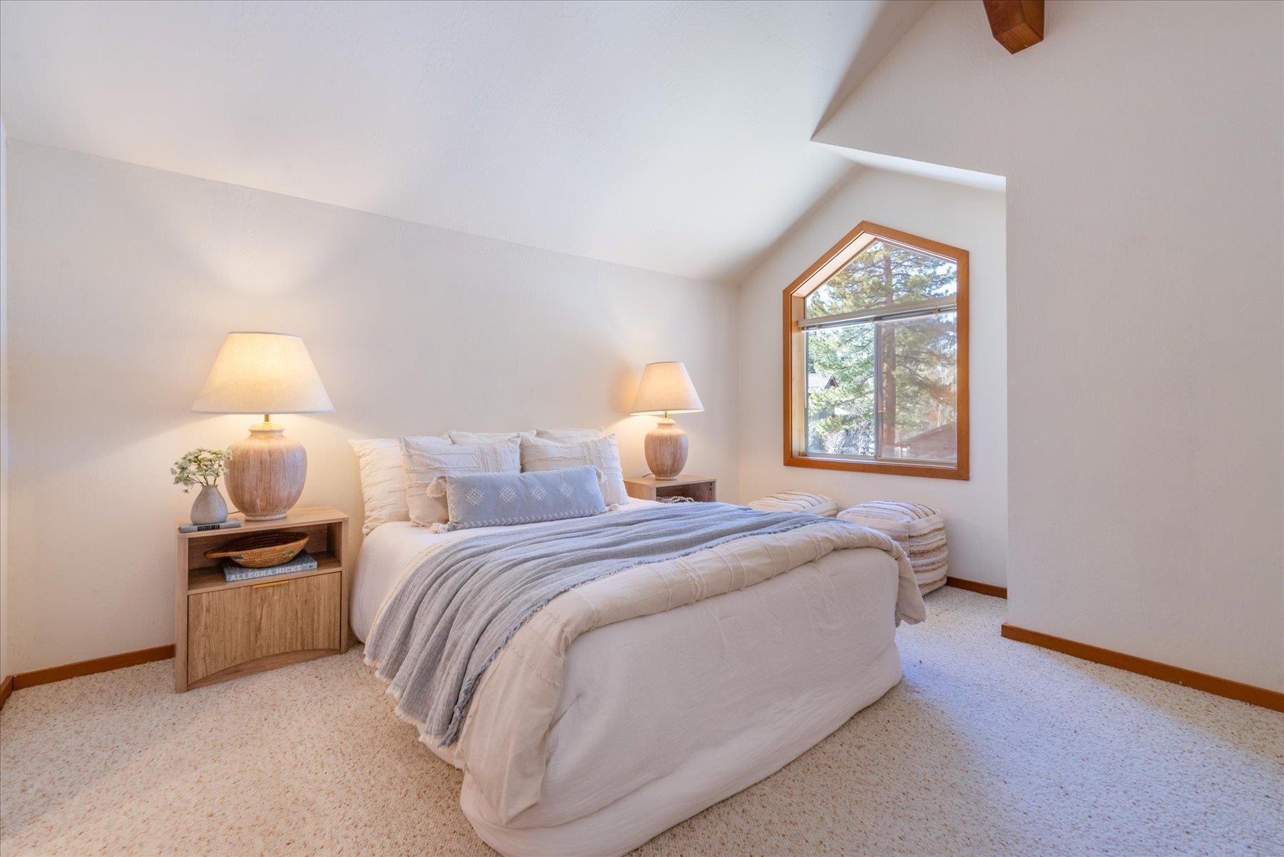 265 Basque Drive Truckee, CA 96161 - Photo 13 of 25 a bedroom with a bed and a lamp