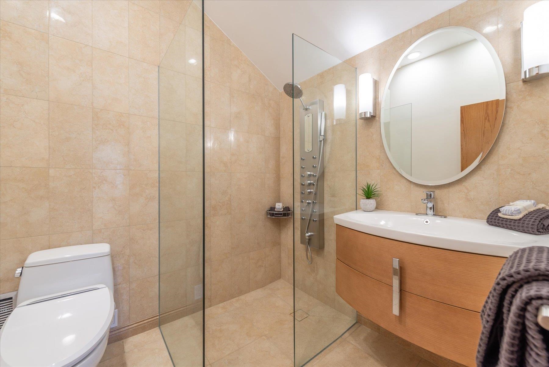 265 Basque Drive Truckee, CA 96161 - Photo 15 of 25 a bathroom with a sink a toilet and a mirror