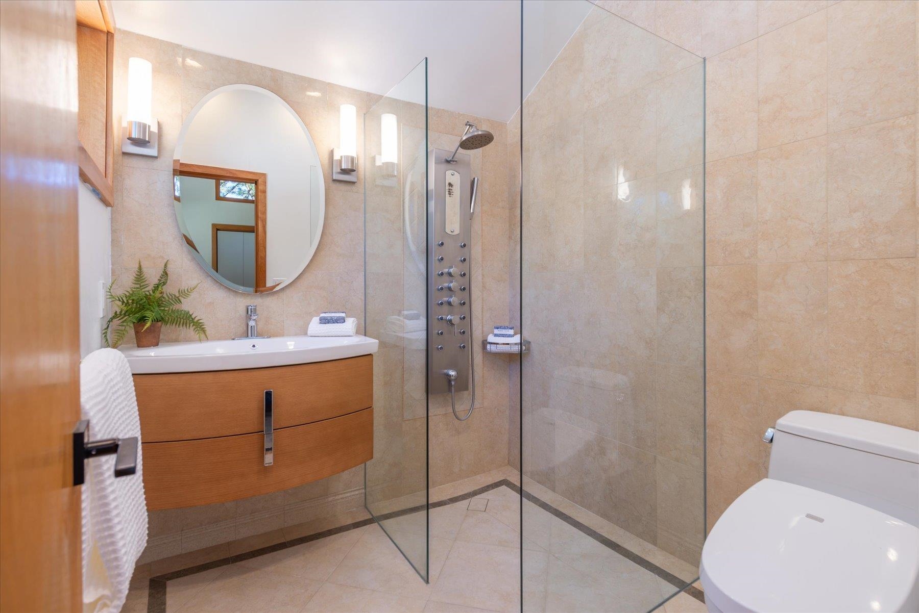 265 Basque Drive Truckee, CA 96161 - Photo 18 of 25 a bathroom with a toilet a sink and mirror