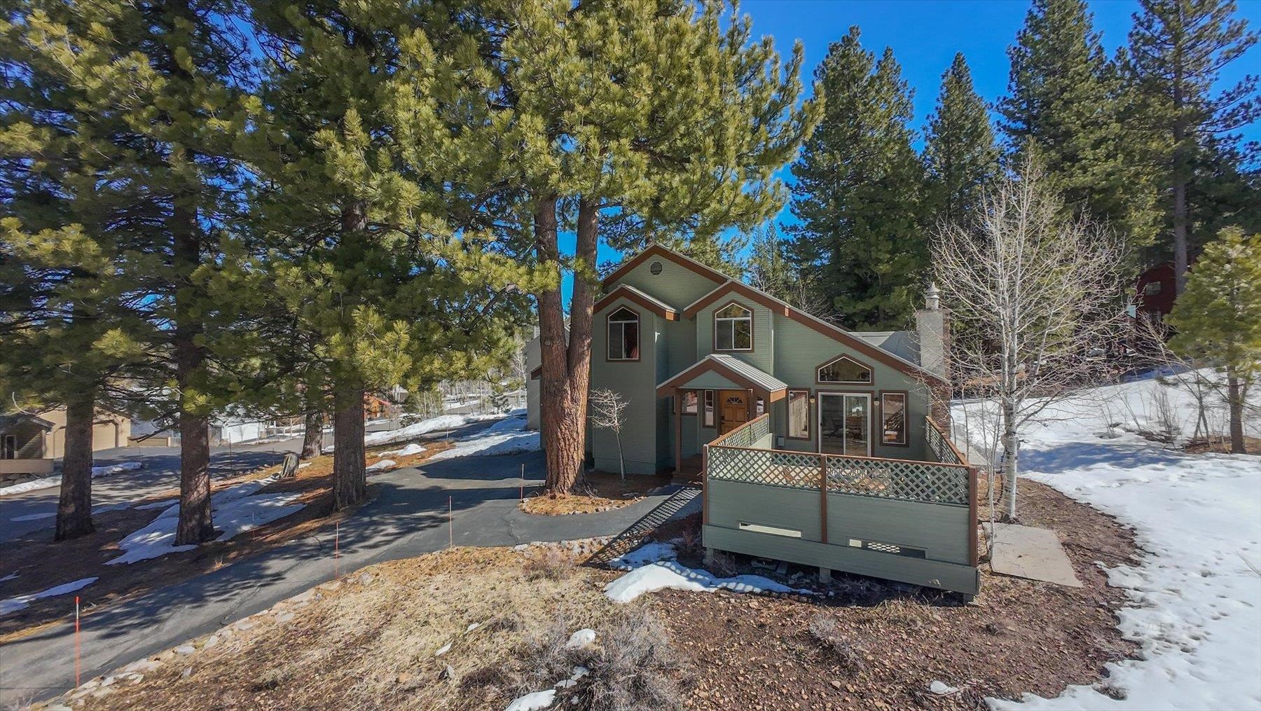 265 Basque Drive Truckee, CA 96161 - Photo 22 of 25 a front view of a house with a yard and large trees