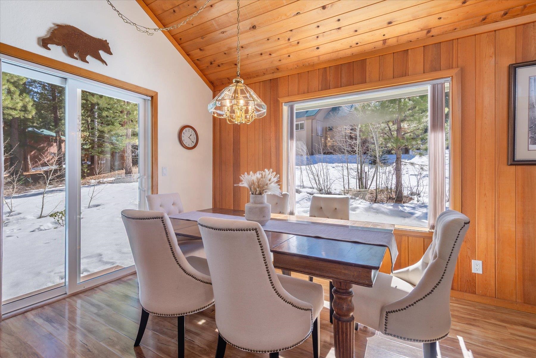 265 Basque Drive Truckee, CA 96161 - Photo 10 of 25 a dining room with furniture a chandelier and wooden floor