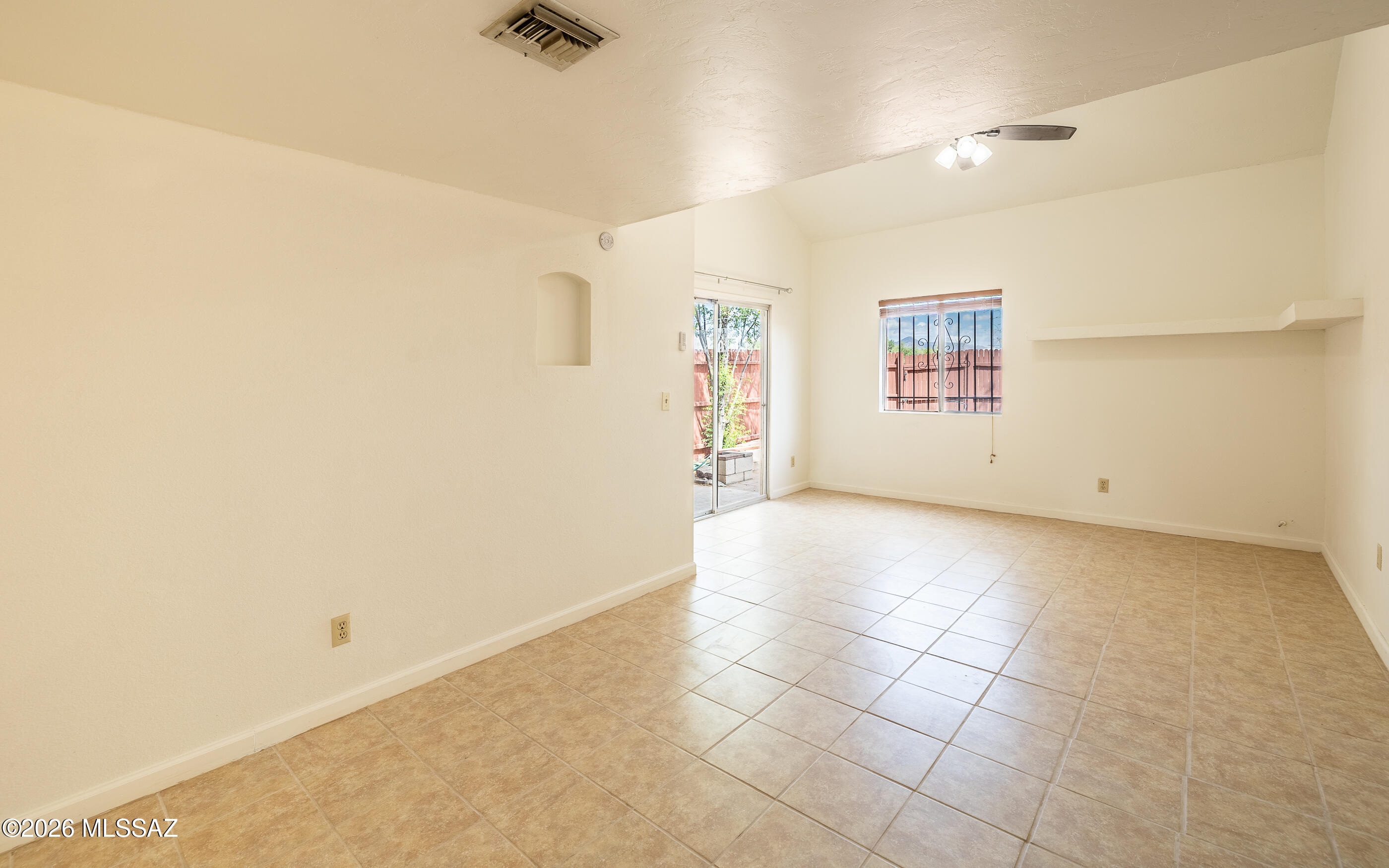 3750 North Country Club Road, Unit 46 Tucson, AZ 85716 - Photo 9 of 34 an empty room with windows
