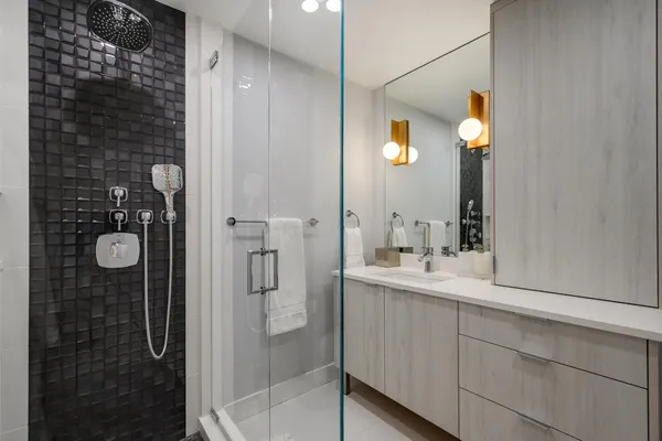a bathroom with a shower and a sink