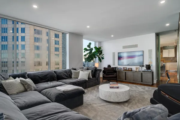 a living room with furniture and a large window