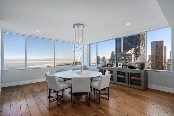 a kitchen with a table and chairs in it