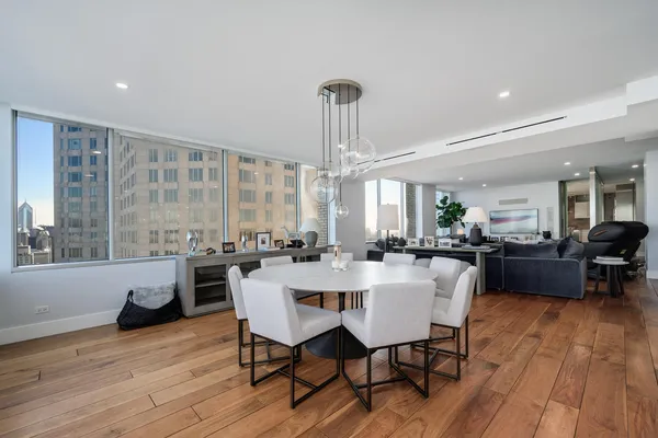 a view of a dining room with furniture window and wooden floor