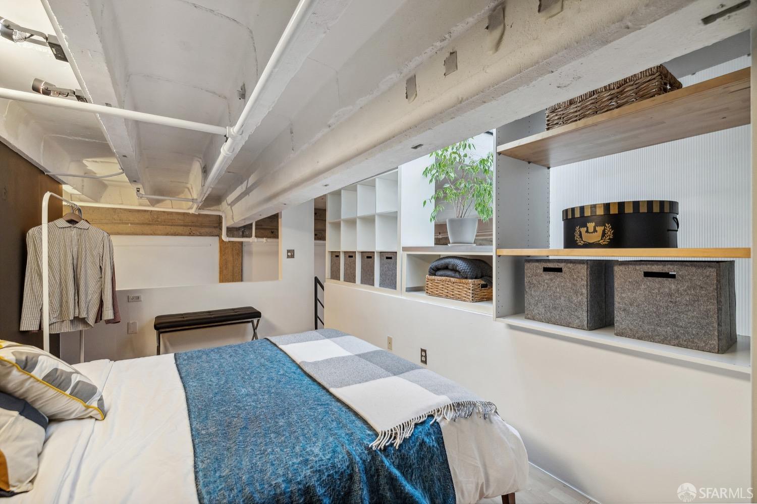 247 4th Street, Unit 406 Oakland, CA 94607 - Photo 13 of 46 a living room with furniture and a window
