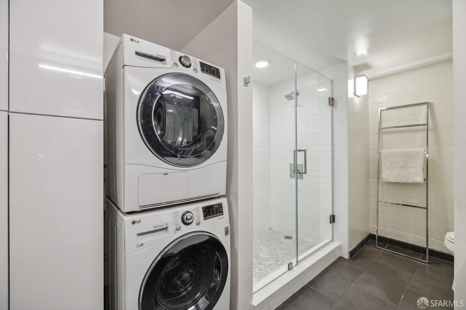 247 4th Street, Unit 406 Oakland, CA 94607 - Photo 18 of 46 a view of a hallway with washer and dryer