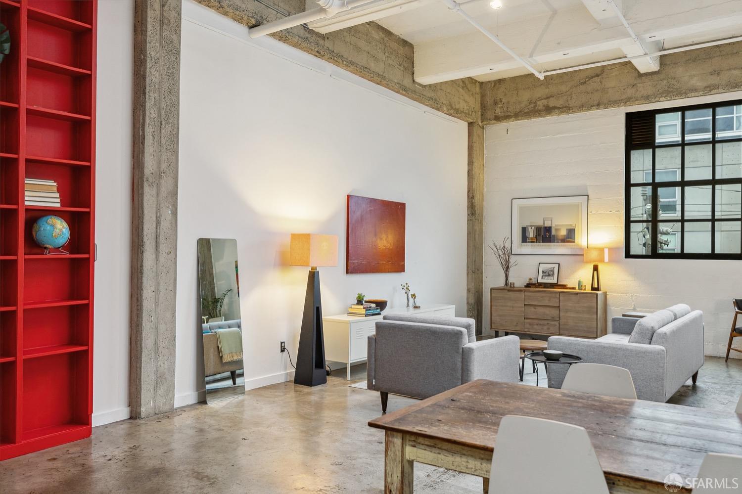 247 4th Street, Unit 406 Oakland, CA 94607 - Photo 20 of 46 a living room with furniture a table and chairs