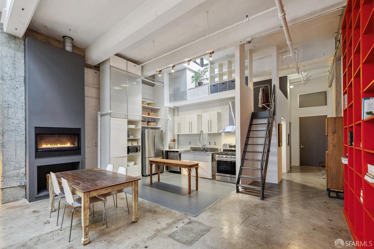 247 4th Street, Unit 406 Oakland, CA 94607 - Photo 27 of 46 a living room with furniture a fireplace and a flat screen tv