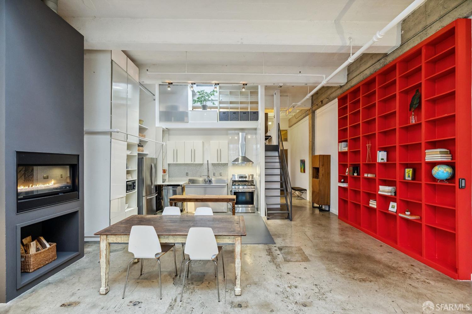 247 4th Street, Unit 406 Oakland, CA 94607 - Photo 28 of 46 a living room with stainless steel appliances kitchen island granite countertop furniture and a fireplace