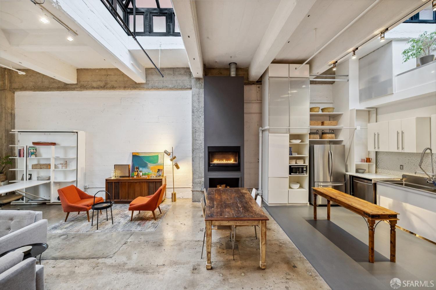 247 4th Street, Unit 406 Oakland, CA 94607 - Photo 29 of 46 a living room with furniture and a rug