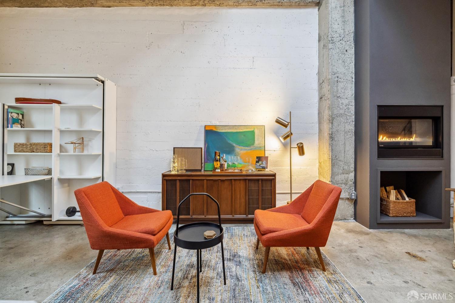 247 4th Street, Unit 406 Oakland, CA 94607 - Photo 30 of 46 a living room with furniture and a fireplace