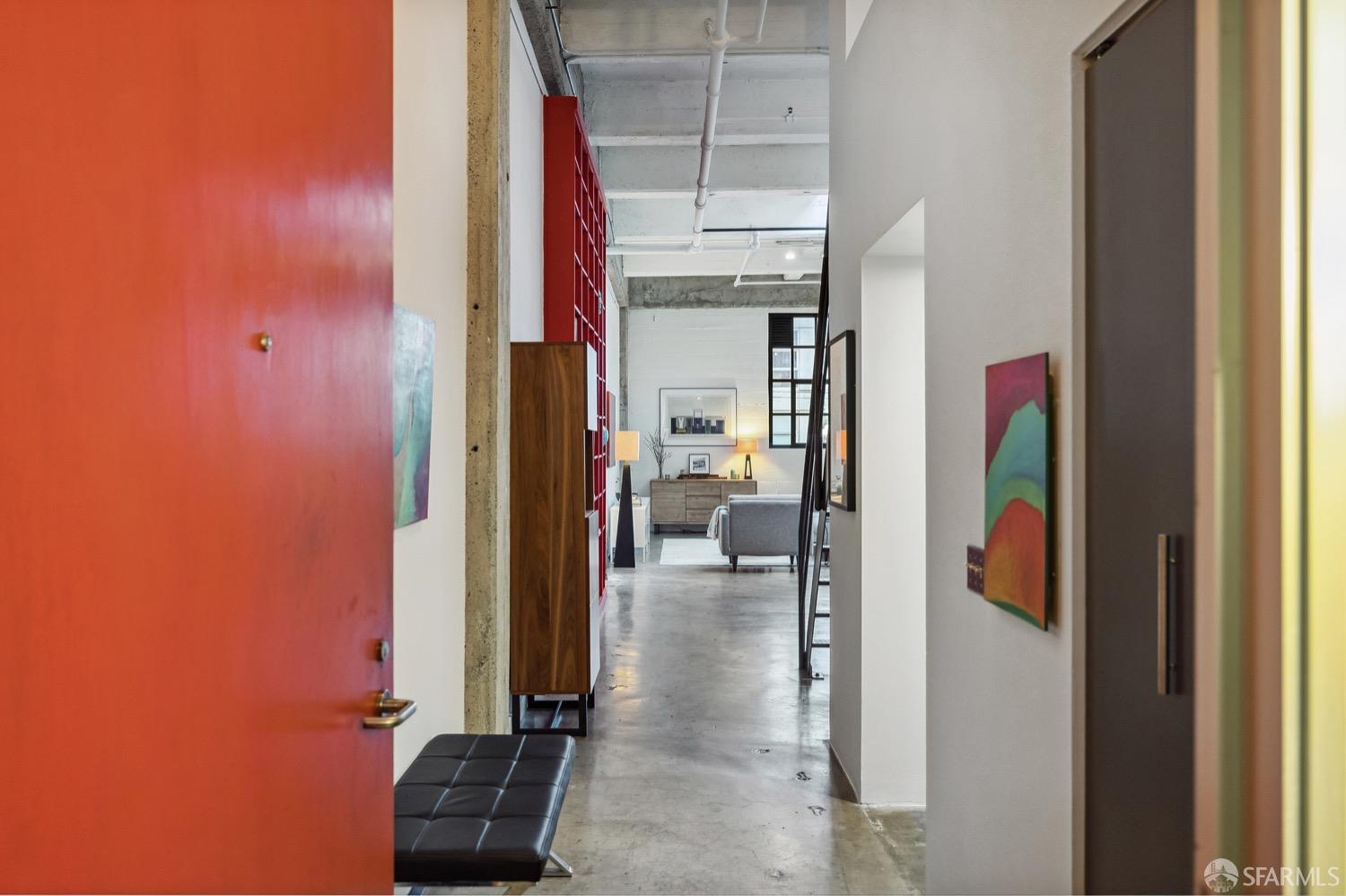 247 4th Street, Unit 406 Oakland, CA 94607 - Photo 3 of 46 a view of a bedroom with a wardrobe