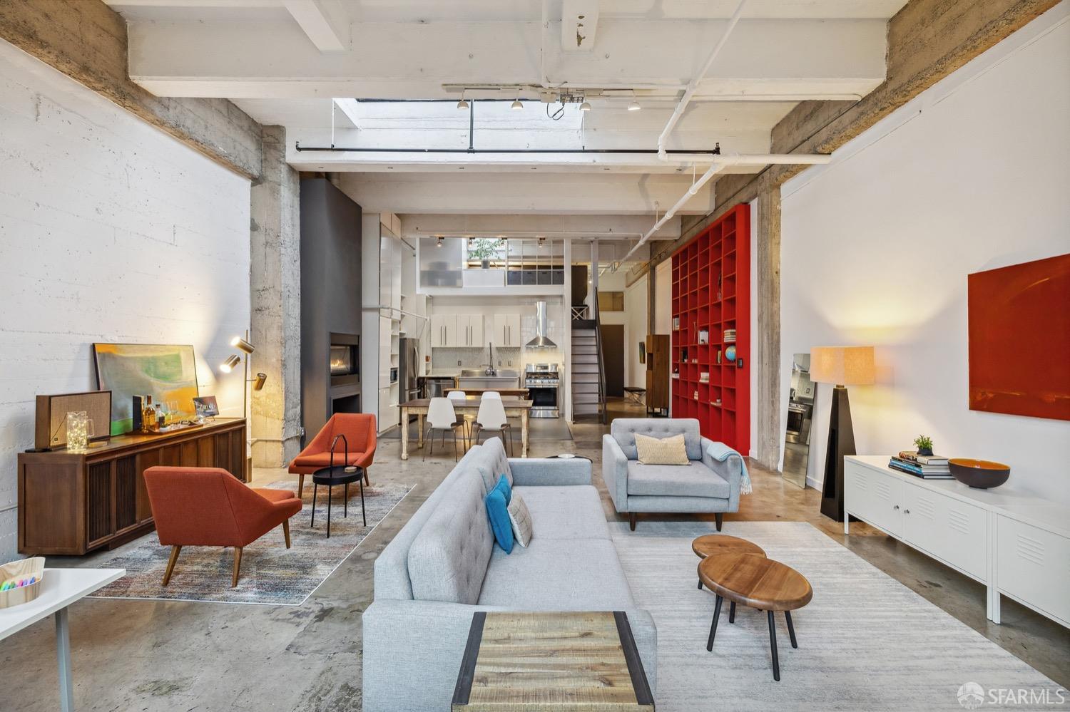 247 4th Street, Unit 406 Oakland, CA 94607 - Photo 34 of 46 a living room with furniture and a flat screen tv