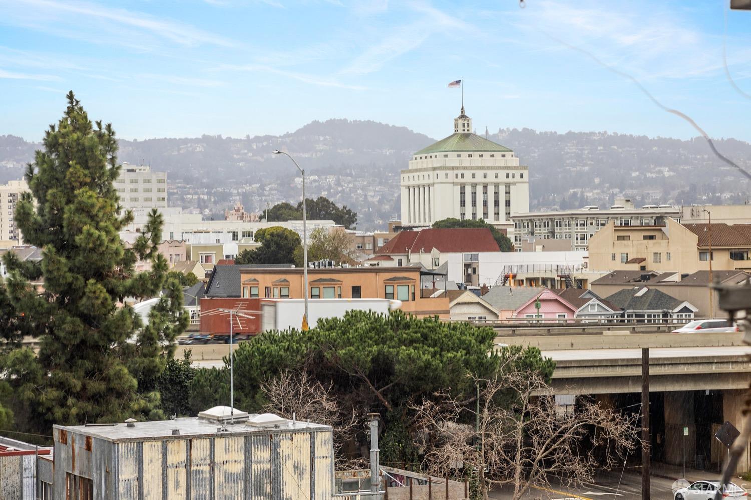 247 4th Street, Unit 406 Oakland, CA 94607 - Photo 39 of 46 a front view of a building with garden