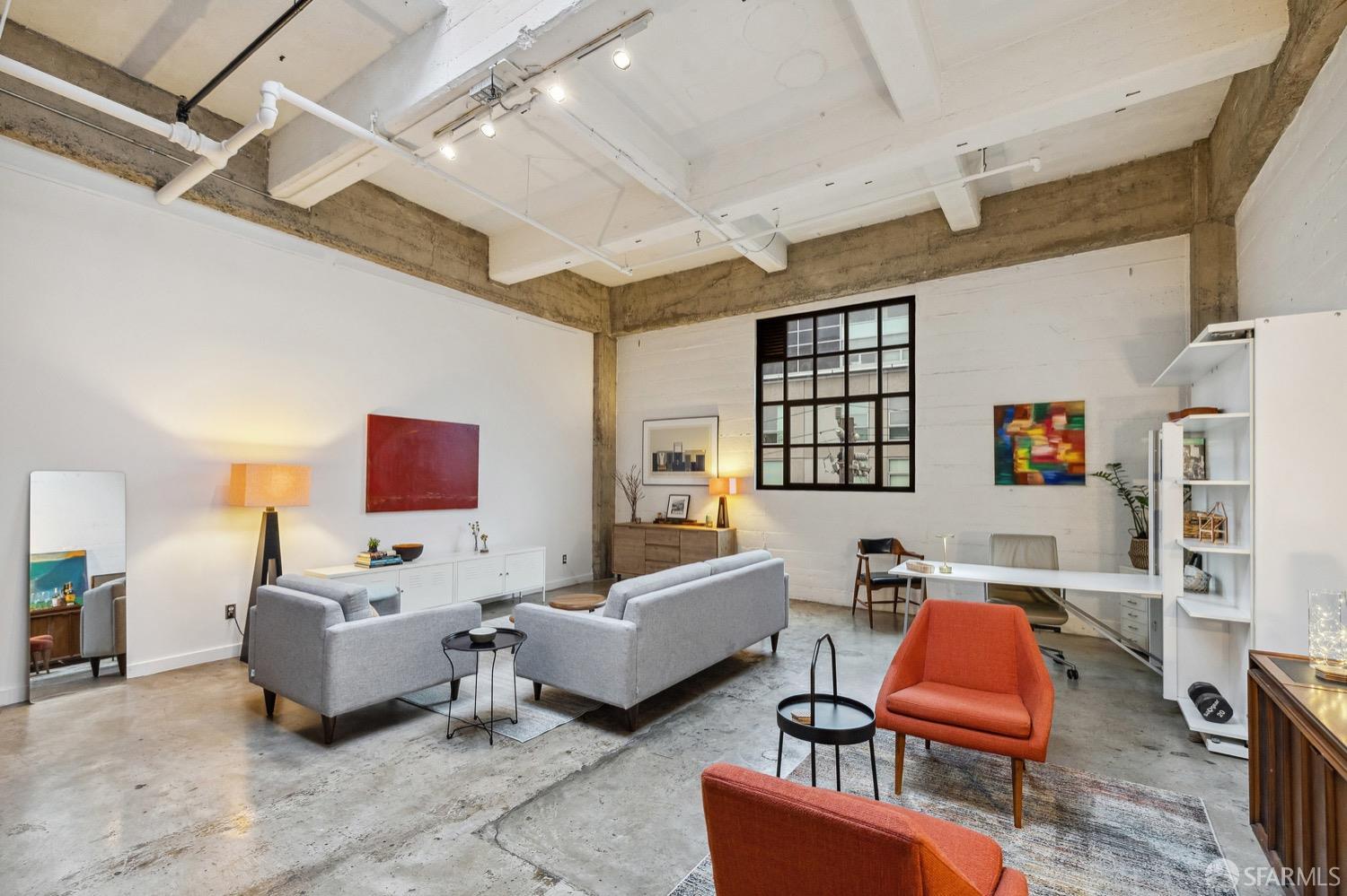 247 4th Street, Unit 406 Oakland, CA 94607 - Photo 8 of 46 a bedroom with furniture and a couch