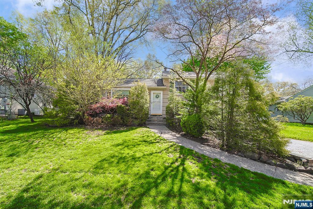 181 Crescent Street Closter, NJ 07624 - Photo 1 of 25 a view of a house with a yard