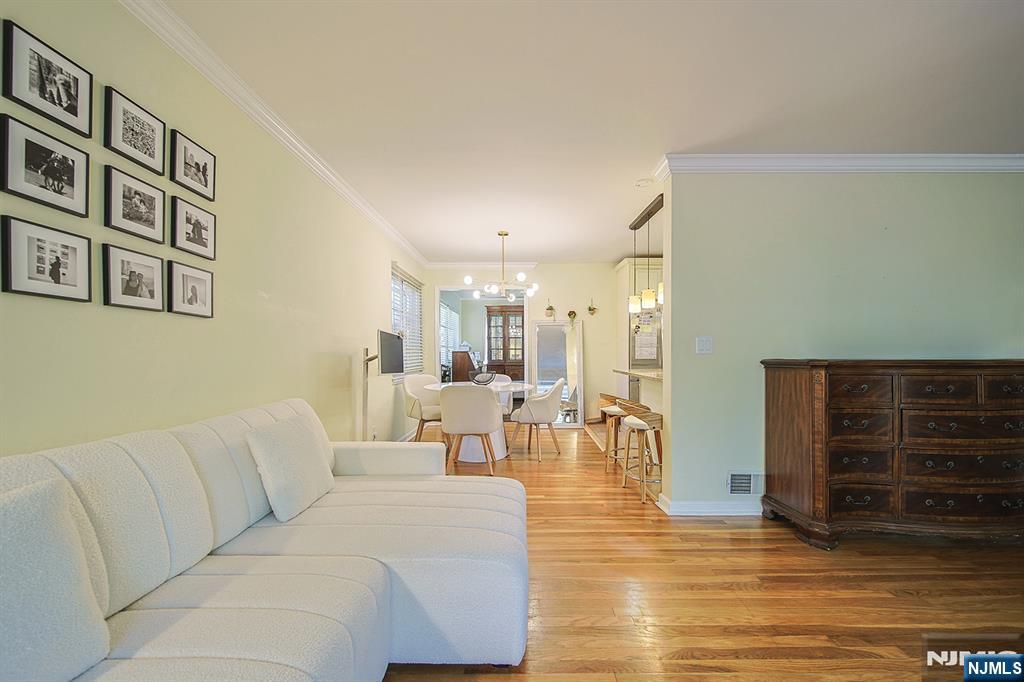 181 Crescent Street Closter, NJ 07624 - Photo 11 of 25 a living room with furniture and wooden floor