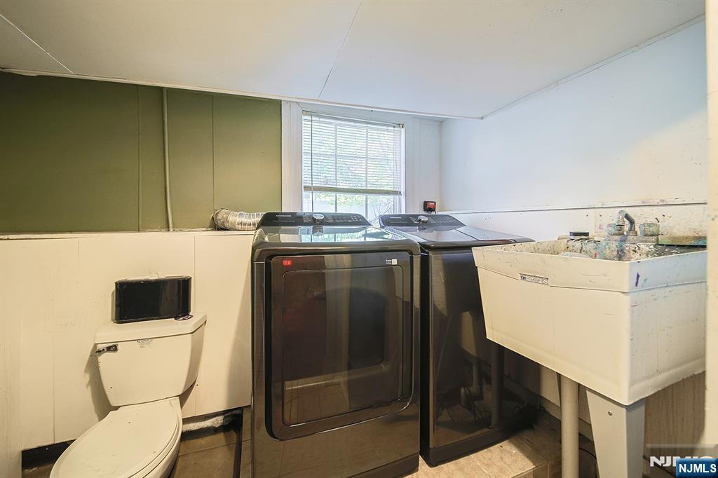 181 Crescent Street Closter, NJ 07624 - Photo 20 of 25 a kitchen with a sink a stove and a microwave
