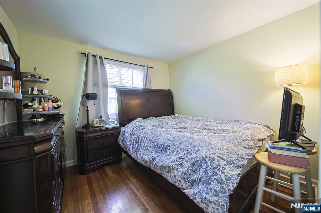 181 Crescent Street Closter, NJ 07624 - Photo 21 of 25 a bedroom with a bed and flat screen tv