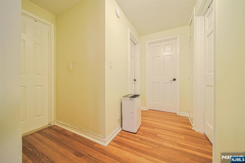 181 Crescent Street Closter, NJ 07624 - Photo 25 of 25 a view of a room with wooden floor and a bathroom