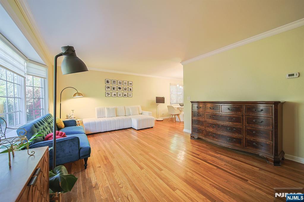 181 Crescent Street Closter, NJ 07624 - Photo 5 of 25 a living room with furniture and a floor to ceiling window