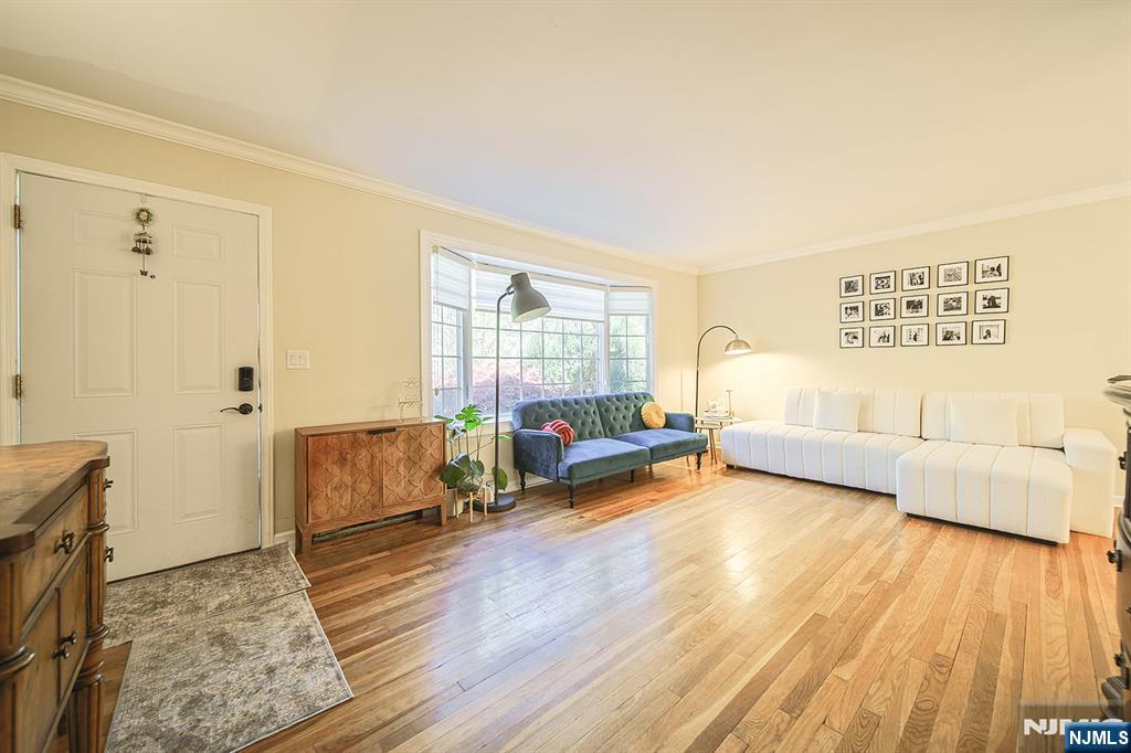 181 Crescent Street Closter, NJ 07624 - Photo 7 of 25 a living room with furniture and a wooden floor