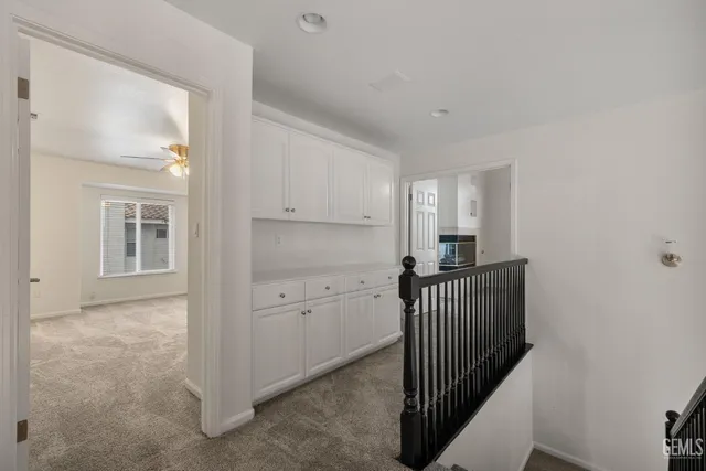 a hallway with cabinets