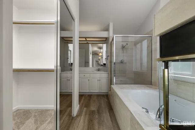 a bathroom with a bathtub and a shower