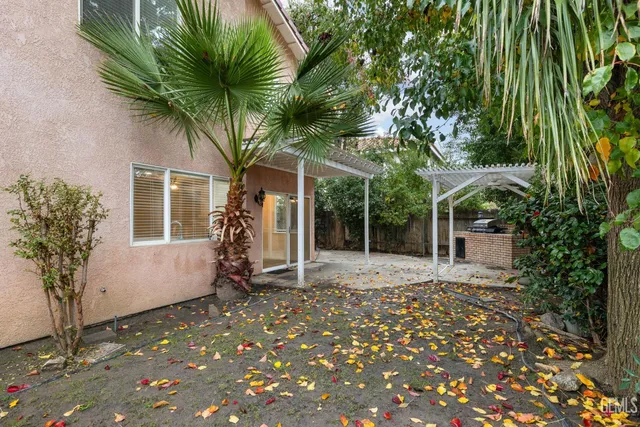 a backyard of a house with seating space