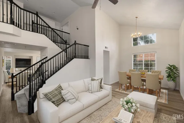 a living room with furniture or wooden floor and a potted plant