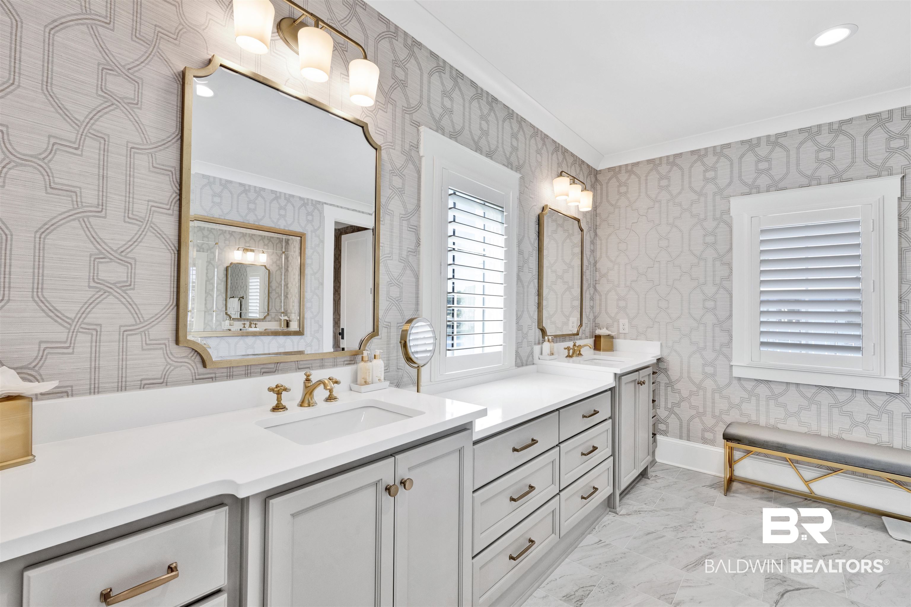 861 Inlet Circle Gulf Shores, AL 36542 - Photo 26 of 54 Full bath with ornamental molding, two vanities, wallpapered walls, and light marble finish floors