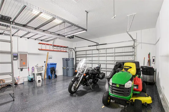 an aerial view of a house with pool and ocean view
