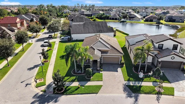 an aerial view of a house with a swimming pool